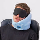 Traveler using the Airze Eze Sleep Bundle with a blue travel pillow and blackout sleep mask, providing neck support and ultimate travel comfort.