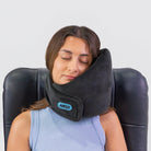 Traveler comfortably resting with the Airze travel pillow in black, highlighting its ergonomic neck support and plush fabric for ultimate travel comfort.