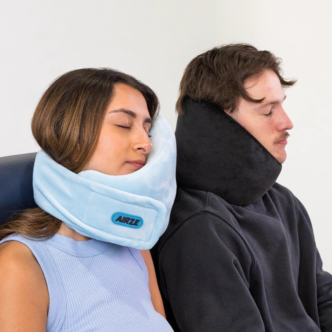 Two travelers comfortably resting with the Airze travel pillow in blue and black, showcasing ergonomic neck support and superior travel comfort.
